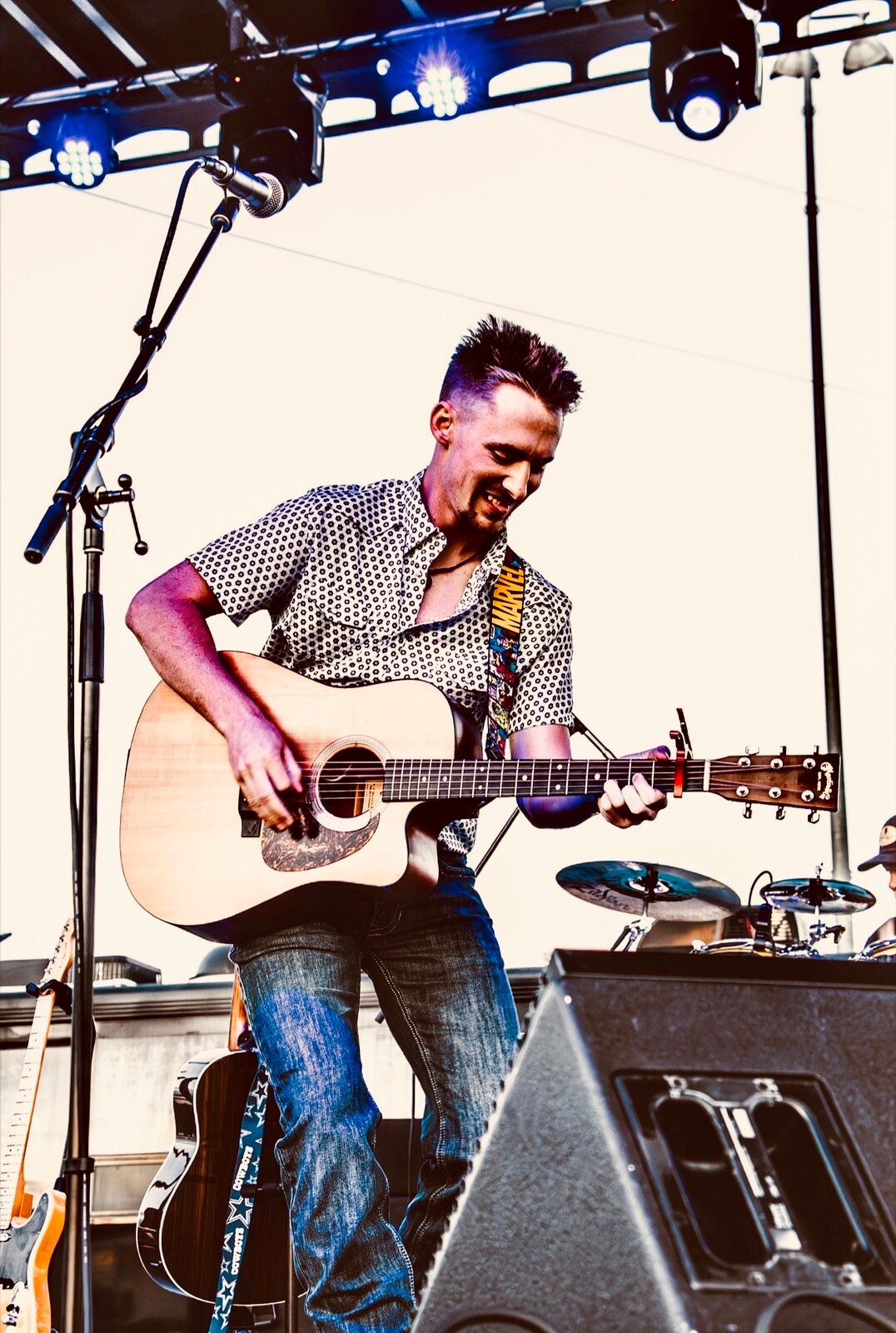 Dillon Leggett performing live on an outdoor stage